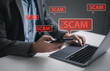 © MrPanya - Smartphones display scam alerts and warnings; concepts related to fraud detection, cybercrime prevention, and digital security awareness.