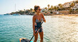 © venars.original - Sexy woman on a paddleboard by the sea during summer vacation, warm light, romantic scene