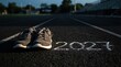 © SimpleDesignStudio - Running shoes on track with 2027 written in chalk for future fitness goals and new year resolution planning