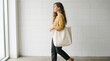 © Deris Firmansyah - Woman is holding bag canvas fabric for mockup blank template.