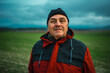 © Nazareno - Senior man smiling wearing warm clothes outdoors