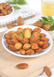 © DinhThi - Roasted Almonds and Mixed Nuts on White Plate - Healthy Natural Snack Food