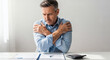 © medicalhealth - Stressed businessman looking at financial documents and calculator suffering from anxiety and business failure.