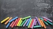 © Volha - Colorful chalk scattered on a blackboard with 'Math 101' written in chalk