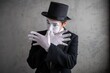 © Nomad_Soul - Male mime artist crossing gloved hands in front of his face