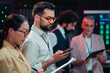 © Zamrznuti tonovi - It professionals working in a data center control room, managing servers, network infrastructure, and cybersecurity operations