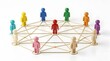 © Elite Studio - Colorful male wooden figures connected by golden communication string network. Concept of corporate human resources, organizational hierarchy structure, and digital social networking.