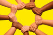 © erick - A symbolic illustration of diverse hands interlocking to form a circle of unity against a bright background. The design represents teamwork, solidarity, diversity, and empowerment, making it ideal for