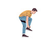 © Jepry - Young man tying shoelaces in a casual setting.