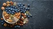 © Sariyono - Assorted Fresh Berries and Nuts on Dark Surface for Healthy Snack Concept.