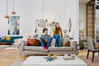 © Westend61 - Couple in modern furniture store sitting on couch, laughing