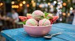 © horizon - Delicious frozen dessert features round scoops of swirled pastel green and pink watermelon ice cream sitting inside a pastel pink bowl.