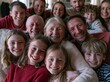 © Ryzhkov - A large multigenerational family with grandparents and children poses for a joyful portrait in a bright living room for lifestyle and holiday media