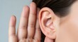 © twilight mist - Close-up of a Woman Cupping Her Hand Behind Her Ear to Listen Intently, Concept of Hearing Loss and Communication