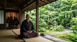 © Xenia - Senior Asian monk meditating on a tatami mat in a traditional Japanese temple. Older man in brown robe sitting cross-legged with a view of a green garden. Zen Buddhism and mindfulness practice