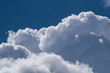 © Stephan - Dramatic view of fluffy white cumulus clouds billowing against a deep blue sky background