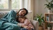 © Ruby - Mother and young daughter sleeping together on a sofa, soft natural light