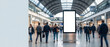 © itlada - Blank vertical billboard in crowded airport terminal, featuring a glowing white mockup screen on a sleek metal stand with blurred passengers walking past for travel advertising