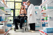 © DC Studio - Pharmacist assists male wheelchair patient with medication guidance, working closely with female caregiver to clarify prescription instructions. Promoting health awareness and safe treatment practice.