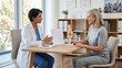 © starush - Physician Reviews Recovery Progress With Adult Patient in Rehab Clinic