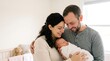 © adi - Adoptive Parents Lovingly Holding Newborn Baby