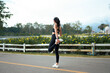 © PaeGAG - Woman stretching leg outdoors preparing for a run