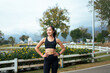 © PaeGAG - Young woman enjoying outdoor workout posing in activewear
