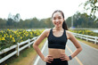 © PaeGAG - Young asian woman smiling enjoying workout in park