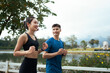 © PaeGAG - Happy young asian couple jogging outdoors together