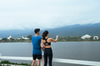 © PaeGAG - Young couple enjoying outdoor view by lake