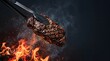 © Tania - Seared steak barbecue food close up of grilled beef tenderloin with flames and smoke