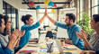 © Shawn - Happy creative business team giving high five celebration at office meeting