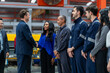 © Verin - CEO shaking hands with a factory worker, diverse industrial workers meeting and greeting corporate executive during manufacturing plant visit