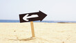 © Andrii - Change to Opposite Direction Sign on Sandy Beach Symbolizing Business Decision, Career Pivot, Better Opportunity, New Strategy, Hesitation, Change Management and Fresh Start