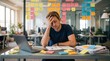 © ozare - Stressed office worker suffering burnout and task overload at desk with laptop paperwork sticky notes and deadline pressure