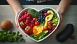 © Richard - clean fruits and vegetables in heart dish by nutritionist