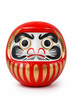 © LOUNA Studio - Red daruma doll on white background traditional Japanese lucky charm