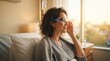 © xuxu - Woman in hospital bed wearing augmented reality glasses, looking up with a cheerful expression. Patient engaging with futuristic medical technology for recovery