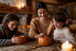 © lashkhidzetim - Warm candlelight glows softly on a rustic wooden table. Mother and two children laugh, sharing pumpkin carving. Their faces light up with joyful anticipation. Cozy autumnal decor enhances the festive