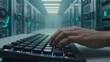 © joeycheung - Hand typing on glowing keyboard in futuristic server room with rows of racks.