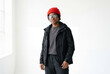 © Meow Creations - Woman wearing winter jacket red beanie and goggles