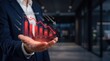 © Hao - Hand holding red graph showing market decline, financial crisis, stock exchange crash, economic recession, loss of profit, investment risk, bear market trend, negative growth, b...
