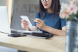 © tippapatt - Close up business woman checking payment invoice bill, doing home finance, accounting with laptop on office table, budget planning and tax calculation