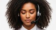 © Green Nature - Close-up of a beautiful Black woman with curly hair wearing a headset, eyes closed, appearing calm