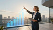 © Wiwat - Businesswoman presentation chart graph growth upward office terrace cityscape tablet blazer suit professional finance strategy success progress analysis planning leadership meeting corporate