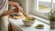 © Ankit Saxena - Person whisking traditional matcha tea in a minimalist kitchen, celebrating mindful rituals, healthy beverages, Japanese inspired culture, wellness, and peaceful daily routines.