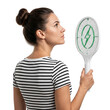 © Adi - Woman holding electric mosquito swatter, looking up, white background, pest control concept