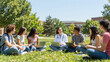© Saranya - Medical student group campus lawn outdoor study laptop computer doctor education friendship diversity teamwork young adult