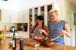 © Rawpixel.com - Joyful cooking in modern kitchen