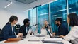 © VAKSMANV - Bearded businessman standing while explaining market charts to team during modern office meeting, surrounded by laptops and printed analytics. Multinational professionals actively engaged.
